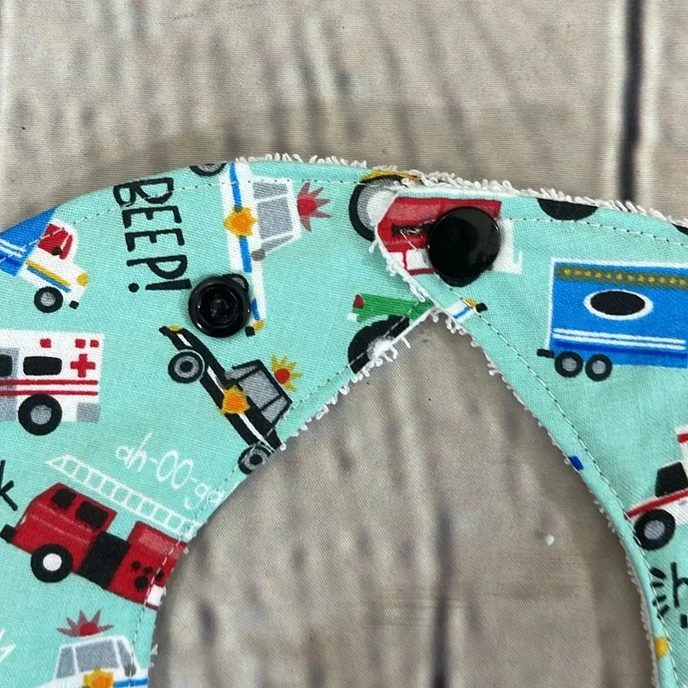 Designer handcrafted transportation bib